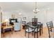 Bright and airy living space featuring hardwood floors, open layout, and a dining area at 2104 Iveywood St, The Villages, FL 32163