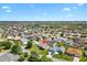 Aerial view highlights the property surrounded by well-maintained homes at 2104 Iveywood St, The Villages, FL 32163