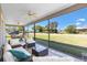 Inviting screened patio featuring comfortable seating, perfect for outdoor relaxation at 2104 Iveywood St, The Villages, FL 32163