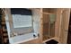 Bright bathroom showcasing a tub with shower and glass shower stall at 2129 Amor Way, Leesburg, FL 34748