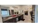 Stylish bathroom featuring granite countertops, double sinks, and decorative elements at 2129 Amor Way, Leesburg, FL 34748