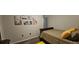 Bedroom with decorative artwork and a decorative bed at 2129 Amor Way, Leesburg, FL 34748