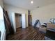 Bedroom with vinyl flooring, a closet, and a view to the en suite bathroom at 2129 Amor Way, Leesburg, FL 34748