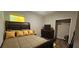 Bedroom with a large decorative bed and a walk-in closet at 2129 Amor Way, Leesburg, FL 34748