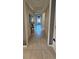 Hallway with tile flooring leads to the front entrance at 2129 Amor Way, Leesburg, FL 34748
