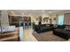 Spacious open-concept living area with dining and comfortable seating at 2129 Amor Way, Leesburg, FL 34748
