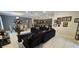 Spacious open-concept living area with dining and comfortable seating at 2129 Amor Way, Leesburg, FL 34748