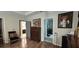 Bedroom view showing wood floors, an ensuite bathroom and a walk-in closet, providing ample storage at 2129 Amor Way, Leesburg, FL 34748