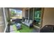 Screened in patio with outdoor seating, grill, and exterior view at 2129 Amor Way, Leesburg, FL 34748