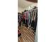 Large walk-in closet with ample storage space and racks for clothing and personal items at 2129 Amor Way, Leesburg, FL 34748