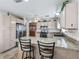 Bright kitchen with granite countertops, stainless steel appliances and a breakfast bar with seating at 2256 Margarita Dr, The Villages, FL 32159