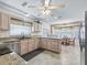 Spacious kitchen with granite countertops, stainless steel appliances, and light wood cabinets at 2256 Margarita Dr, The Villages, FL 32159