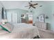 Bright bedroom with a large bed, soft decor, and plenty of closet space at 2256 Margarita Dr, The Villages, FL 32159