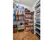 Organized walk-in closet with ample storage for clothes, shoes, and accessories at 25524 Maurepas Ln, Leesburg, FL 34748