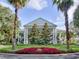 Beautiful building framed by palm trees and manicured landscaping, creating a welcoming atmosphere at 25524 Maurepas Ln, Leesburg, FL 34748