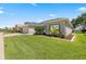 This house boasts a well-manicured lawn and an inviting exterior enhanced by lush landscaping at 25524 Maurepas Ln, Leesburg, FL 34748