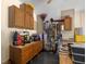 Organized garage storage with cabinets and hanging racks for tools at 25524 Maurepas Ln, Leesburg, FL 34748