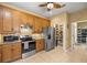 Functional kitchen featuring stainless steel appliances, ample storage, and tile flooring at 25524 Maurepas Ln, Leesburg, FL 34748