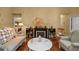 Comfortable living room with striped chair, fireplace, and cozy decor at 25524 Maurepas Ln, Leesburg, FL 34748