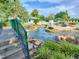 Resort-style pool with waterfalls, lush landscaping, spa and seating areas for ultimate relaxation at 25524 Maurepas Ln, Leesburg, FL 34748
