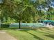 Shuffleboard court amid lush greenery, offering a serene recreational space at 25524 Maurepas Ln, Leesburg, FL 34748