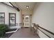 Welcoming covered porch with a bench and views of the surrounding neighborhood at 27022 Racquet Cir, Leesburg, FL 34748