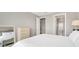 Bedroom with a large bed, dresser, and ensuite bath at 2786 Top Hill Ct, Minneola, FL 34715