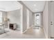 Open-concept foyer with light wood-look flooring and neutral paint, leading to an office and other living spaces at 2786 Top Hill Ct, Minneola, FL 34715