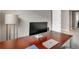 Functional home office space with a desk, chair, modern lamp and a window for natural light at 2786 Top Hill Ct, Minneola, FL 34715