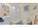 Bathroom featuring a walk-in shower, single sink vanity and standard toilet at 2855 Picadilly Cir, Kissimmee, FL 34747