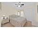 Cozy bedroom features a ceiling fan, closet, and natural light at 2855 Picadilly Cir, Kissimmee, FL 34747