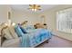 This bedroom has two twin beds, a ceiling fan, and a dresser at 2855 Picadilly Cir, Kissimmee, FL 34747