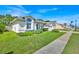 Well maintained home featuring a two-car garage, pristine lawn, and thoughtfully placed shrubbery at 2855 Picadilly Cir, Kissimmee, FL 34747