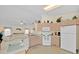 Kitchen featuring white appliances and an open floor plan at 2855 Picadilly Cir, Kissimmee, FL 34747