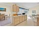 Open concept kitchen featuring ample cabinetry and a dining area at 2855 Picadilly Cir, Kissimmee, FL 34747