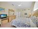 Cozy bedroom with a light color scheme, ceiling fan and plush carpeting perfect for rest and relaxation at 2855 Picadilly Cir, Kissimmee, FL 34747