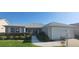 Charming single-story home featuring a well-maintained front yard and attached garage at 3096 Maywood Ct, The Villages, FL 32162