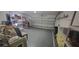 Spacious two-car garage with ample storage and shelving, offering plenty of room for vehicles and organization at 3096 Maywood Ct, The Villages, FL 32162