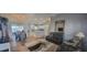 Open-concept living room and kitchen area with stylish furnishings, decor, and updated lighting fixtures at 3096 Maywood Ct, The Villages, FL 32162