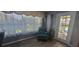 Relaxing office features a comfortable recliner, large windows, and an exterior door at 3096 Maywood Ct, The Villages, FL 32162