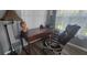 Office space with a wood desk, comfortable office chair, and plenty of natural light at 3096 Maywood Ct, The Villages, FL 32162