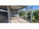 Screened-in patio with a glass table, chairs, and view of a garden, providing a relaxing outdoor retreat at 3096 Maywood Ct, The Villages, FL 32162
