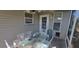 Covered patio with table and chairs offers a great outdoor living and dining area at 3096 Maywood Ct, The Villages, FL 32162