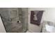 Nicely tiled walk-in shower with a built-in bench and a convenient grab bar for safety at 3096 Maywood Ct, The Villages, FL 32162