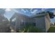 Gray exterior siding and windows showcasing the sunroom addition at 3096 Maywood Ct, The Villages, FL 32162