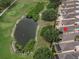 Beautiful aerial view of a home located next to a pond and golf course at 3325 Archer Ave, The Villages, FL 32162