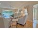 Comfortable living room with a ceiling fan, hardwood floors, and elegant decor at 3325 Archer Ave, The Villages, FL 32162