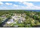 Expansive aerial view showcasing the neighborhood, canal access and lake in the distance at 33635 Jeffery Ct, Leesburg, FL 34788
