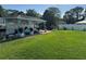 Waterfront property with a boat dock and lush green lawn at 33635 Jeffery Ct, Leesburg, FL 34788