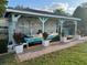 Boat on boat lift with white picket fence and manicured lawn at 33635 Jeffery Ct, Leesburg, FL 34788